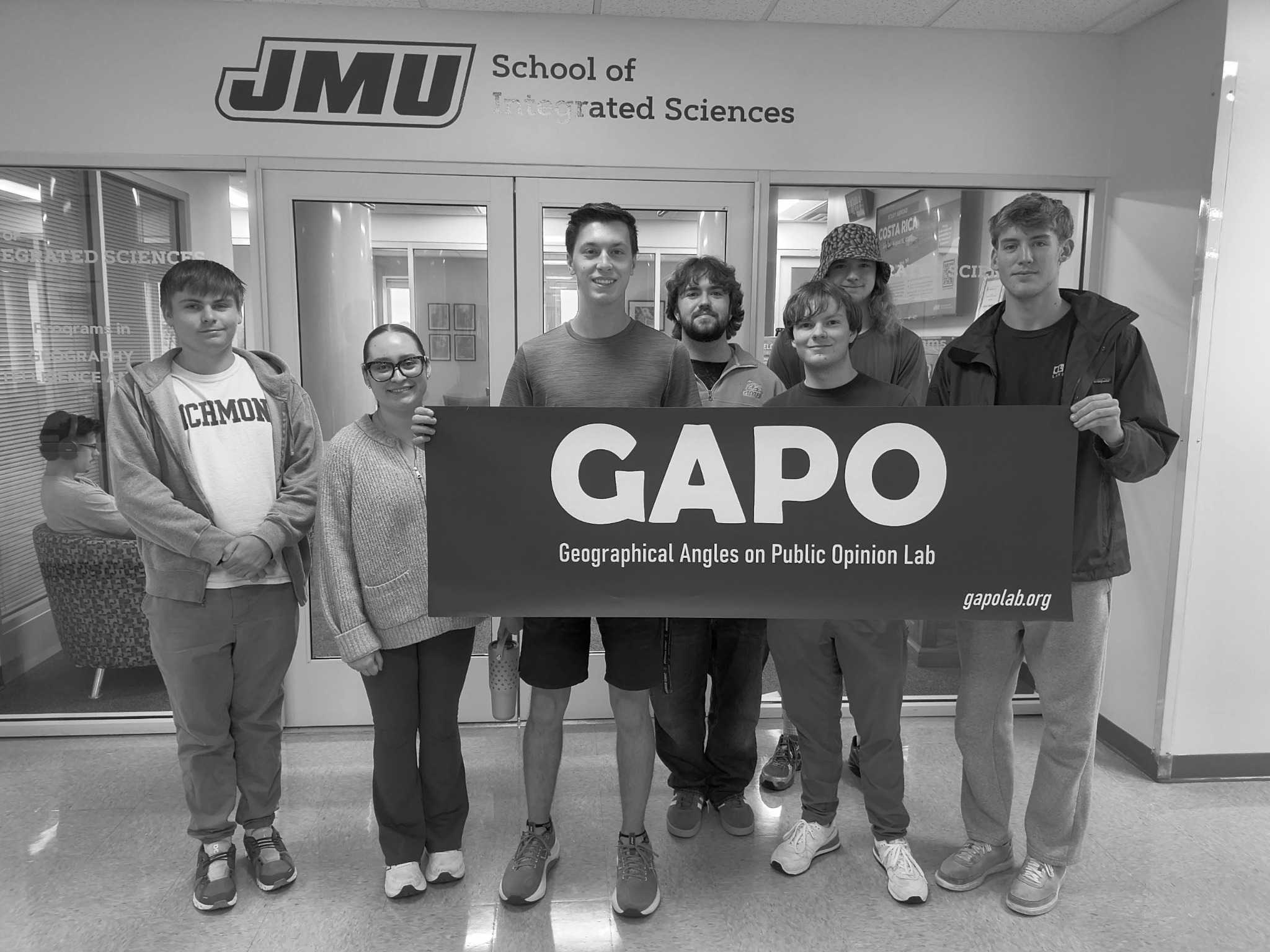 Group photo of the 2026–2027 GAPO student members standing with a GAPO sign at James Madison University.